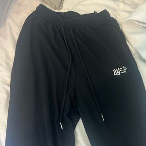 Black UNSP sweatpants.
